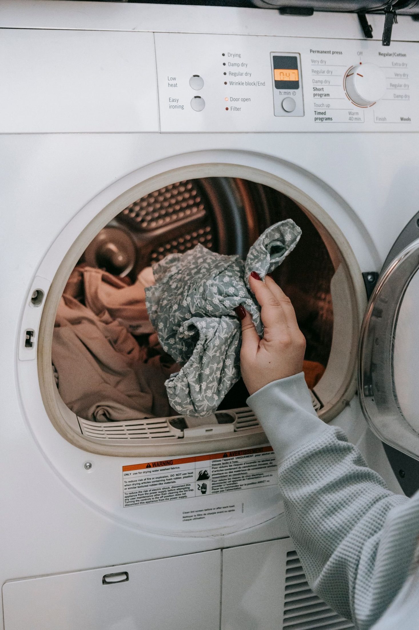 Pulling a towel from an open front load machine